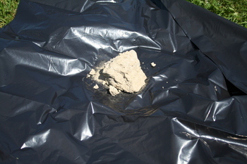 raw clump of dug-up clay raw clump of dug up clay