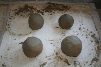 four lumps of prepared test clay four lumps of prepared test clay